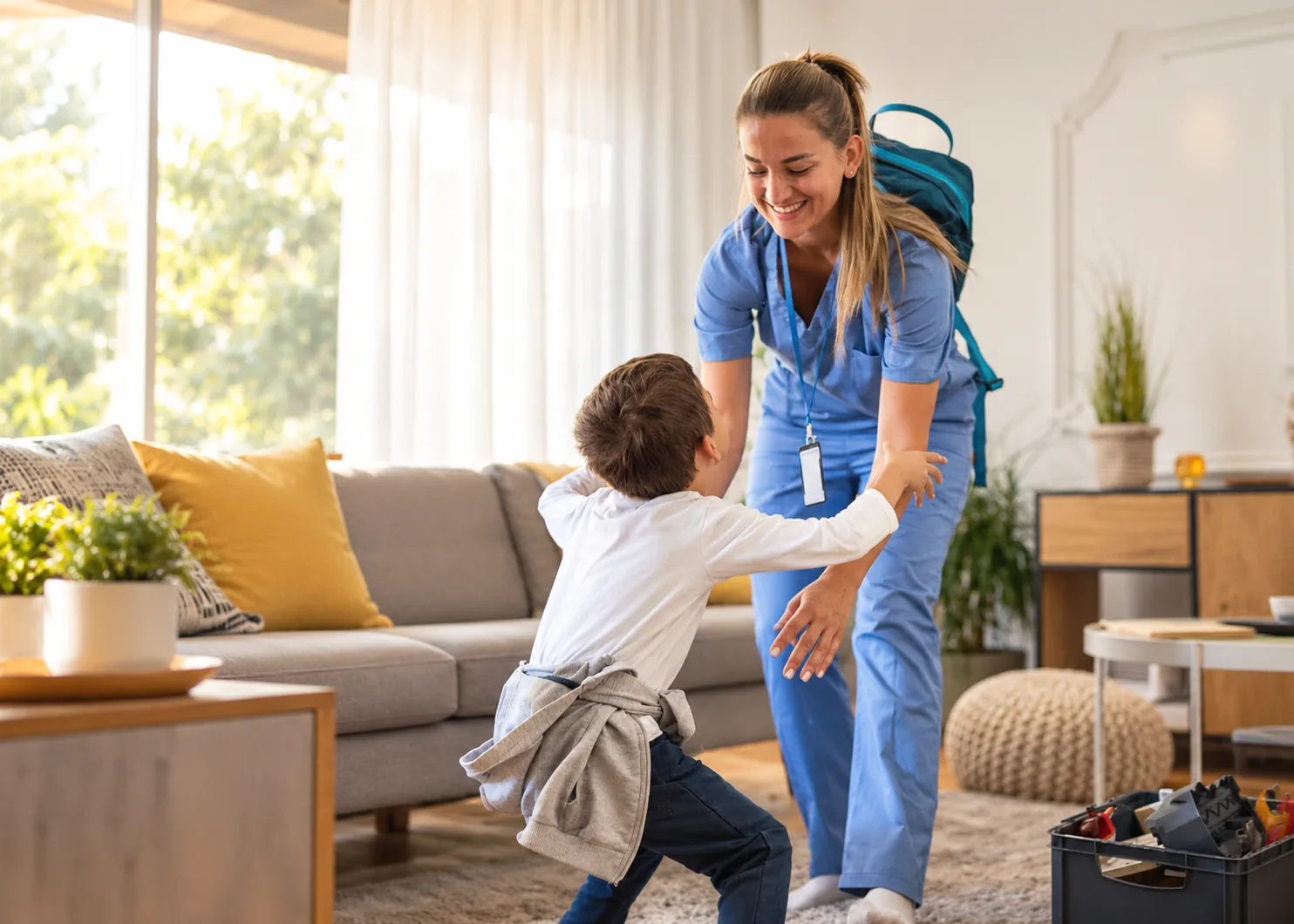 A young boy running with open arms to greet an Atlas provider in his own living room